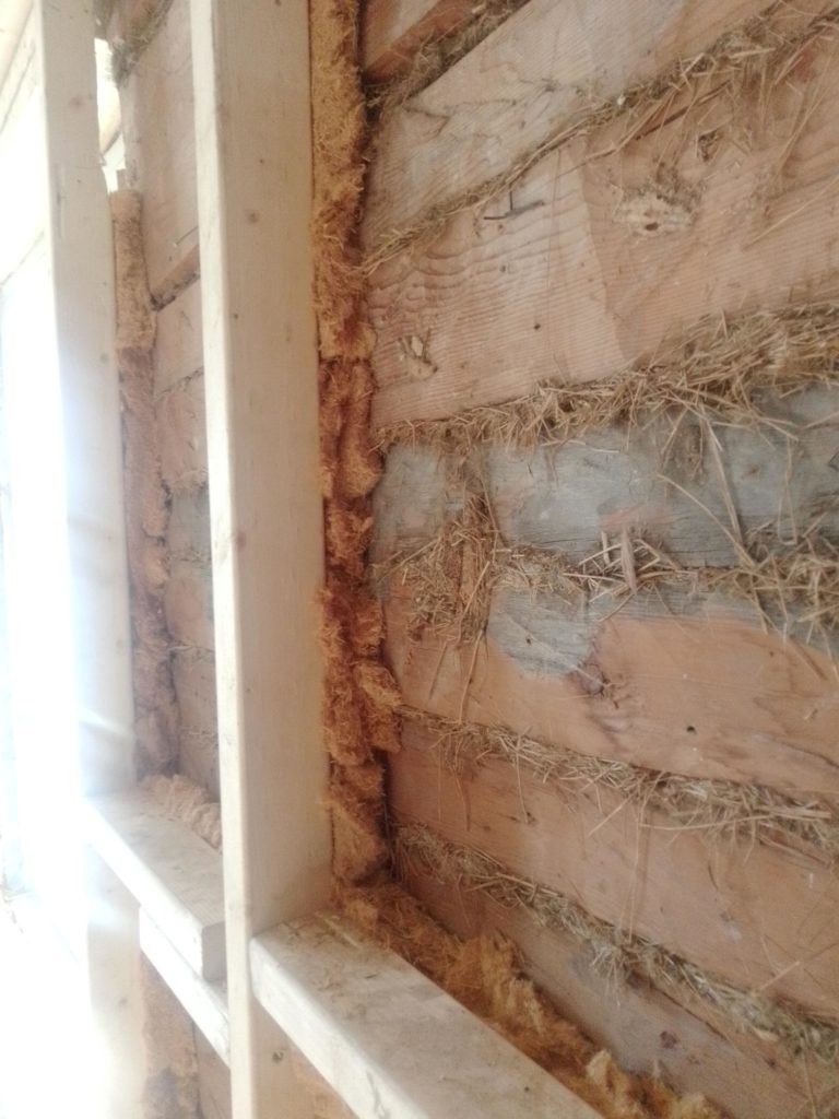 Installing wall insulation: fill in gaps behind the wall framing